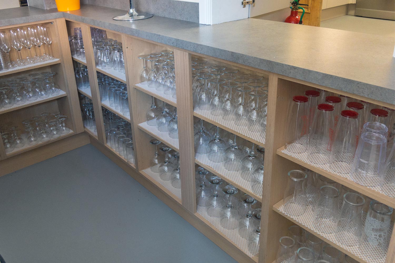 Bar area with glasses on shelves