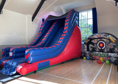 A picture of a bouncy slide inside of the Main Hall at Dumbleton Village Hall